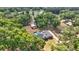 Aerial view of home with fenced pool, detached garage, and additional outdoor storage shed at 5865 Ross Creek Rd, Lakeland, FL 33810
