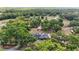 Ariel view of the residence and property, surrounded by mature trees and lush landscapes at 5865 Ross Creek Rd, Lakeland, FL 33810