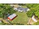 Aerial view of property with a pool, outbuilding, and ample yard space on a picturesque lot at 5865 Ross Creek Rd, Lakeland, FL 33810