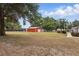 The barn has an adjacent yard with some gardening and landscaping visible at 5865 Ross Creek Rd, Lakeland, FL 33810