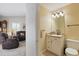 Powder room off living room features single sink and white vanity at 5865 Ross Creek Rd, Lakeland, FL 33810