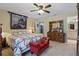 Bedroom with a ceiling fan and a decorative wall tapestry at 5865 Ross Creek Rd, Lakeland, FL 33810