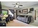 Bedroom featuring a daybed, built-in shelving, and a desk with natural lighting at 5865 Ross Creek Rd, Lakeland, FL 33810