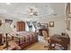 Comfortable bedroom featuring a ceiling fan, a study and an armoire at 5865 Ross Creek Rd, Lakeland, FL 33810