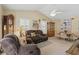 Living room with recliner sofas, ceiling fan, wood floors and interior decor at 5865 Ross Creek Rd, Lakeland, FL 33810