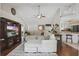 Spacious living room with vaulted ceiling, large TV, and an open layout to the kitchen and dining area at 5865 Ross Creek Rd, Lakeland, FL 33810