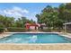 Outdoor pool with a brick paver patio and outdoor red barn at 5865 Ross Creek Rd, Lakeland, FL 33810