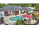 Inviting backyard pool with brick pavers, lounge area, and patio seating perfect for entertaining at 5865 Ross Creek Rd, Lakeland, FL 33810