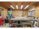 A carpeted table and storage make this a versatile workshop space at 5865 Ross Creek Rd, Lakeland, FL 33810