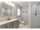 Updated bathroom featuring modern fixtures, a tiled shower, and a sleek vanity for comfort at 613 Clairmont Ln, South Daytona, FL 32119