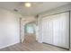Bedroom featuring closet and French doors to other rooms at 613 Clairmont Ln, South Daytona, FL 32119
