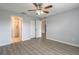 Bright bedroom featuring wood-look floors and neutral walls, offering a blank canvas at 613 Clairmont Ln, South Daytona, FL 32119
