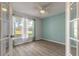 Bright bedroom featuring laminated wood flooring and lots of natural light at 613 Clairmont Ln, South Daytona, FL 32119
