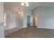 Inviting foyer showcases tile and wood flooring and leads to various rooms of the home at 613 Clairmont Ln, South Daytona, FL 32119