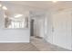 Bright entryway showcasing stylish flooring and an open view of the modern kitchen at 613 Clairmont Ln, South Daytona, FL 32119