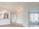 Welcoming foyer with views of the kitchen, front door, and a glimpse into another room at 613 Clairmont Ln, South Daytona, FL 32119