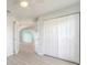A hallway leading into a living space, with a large closet at 613 Clairmont Ln, South Daytona, FL 32119