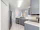 Modern kitchen featuring stainless steel appliances and updated fixtures with ample counter space at 613 Clairmont Ln, South Daytona, FL 32119