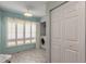 This is a charming laundry room with bright natural light and a washer and dryer at 613 Clairmont Ln, South Daytona, FL 32119