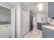 Practical laundry area with washer, dryer, and storage; convenient and efficient for chores at 613 Clairmont Ln, South Daytona, FL 32119