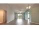 Bright living room with sliding glass doors and wood look floors at 613 Clairmont Ln, South Daytona, FL 32119