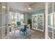 Comfortable office space featuring a bookshelf and bright blue chair at 613 Clairmont Ln, South Daytona, FL 32119