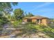 The backyard featuring the back exterior of the home with a screened in porch and yard at 881 Westline Ave, Deltona, FL 32725