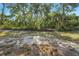 The property is wooded, allowing for a tranquil outdoor space at 881 Westline Ave, Deltona, FL 32725