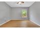 Bright, spacious bedroom with wood flooring and a large window at 881 Westline Ave, Deltona, FL 32725