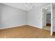 Bedroom with wood flooring, ceiling fan, neutral paint and base trim at 881 Westline Ave, Deltona, FL 32725