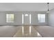 Foyer featuring tiled entry, carpet and front door flanked by sidelight windows at 881 Westline Ave, Deltona, FL 32725