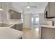 Well-lit kitchen with tiled floor, white countertops, and grey cabinetry at 881 Westline Ave, Deltona, FL 32725