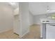 Laundry room with washer, dryer, tile flooring, and adjacent to the kitchen area at 881 Westline Ave, Deltona, FL 32725