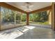 The screened patio overlooks a lush backyard, providing a serene, private outdoor area at 881 Westline Ave, Deltona, FL 32725