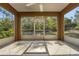 Relaxing screened patio area offers a peaceful outdoor retreat at 881 Westline Ave, Deltona, FL 32725