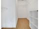 Spacious walk-in closet with built-in shelving and ample storage space at 881 Westline Ave, Deltona, FL 32725