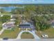 Aerial shot showcasing the home, yard, and nearby lake at 991 Dawson Dr, Deltona, FL 32725