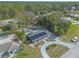 Aerial view of home with solar panels, shed, and circular driveway at 991 Dawson Dr, Deltona, FL 32725