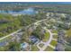 Overhead shot of a charming lakeside community nestled amid lush trees and serene waters at 991 Dawson Dr, Deltona, FL 32725