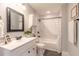 Bathroom featuring white vanity, updated fixtures and a shower/tub combo at 991 Dawson Dr, Deltona, FL 32725