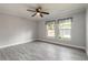 Bedroom boasts tile flooring and natural light through its windows at 991 Dawson Dr, Deltona, FL 32725