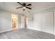 Bedroom features tile flooring, closet space and access to the bathroom at 991 Dawson Dr, Deltona, FL 32725
