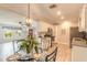 Charming eat-in kitchen with modern appliances, wooden floors and stylish décor, adjacent to living area at 991 Dawson Dr, Deltona, FL 32725