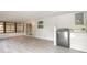 Bright, enclosed laundry room with washer and dryer hookups and tile floors at 991 Dawson Dr, Deltona, FL 32725