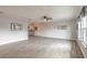 Bright and airy living room showcasing neutral wall paint, tile floors, and natural light from the windows at 991 Dawson Dr, Deltona, FL 32725
