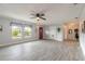 Open living space with tile floors, neutral walls, ceiling fan, and a view of other rooms at 991 Dawson Dr, Deltona, FL 32725