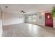 Cozy living room with tiled flooring, neutral paint, a ceiling fan, and a red front door at 991 Dawson Dr, Deltona, FL 32725