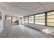Enclosed sunroom with lots of windows and light, with tile floors at 991 Dawson Dr, Deltona, FL 32725