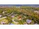 Aerial view of a house, surrounded by lush greenery and mature trees at 1 Crooked Bridge Way, Ormond Beach, FL 32174