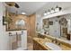 Bright bathroom with a glass shower, granite countertop, and a large mirror with overhead lighting at 1 Crooked Bridge Way, Ormond Beach, FL 32174